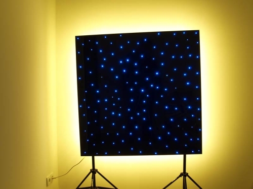 Ceiling panel with a blue starry sky and a warm white glow.jpg
